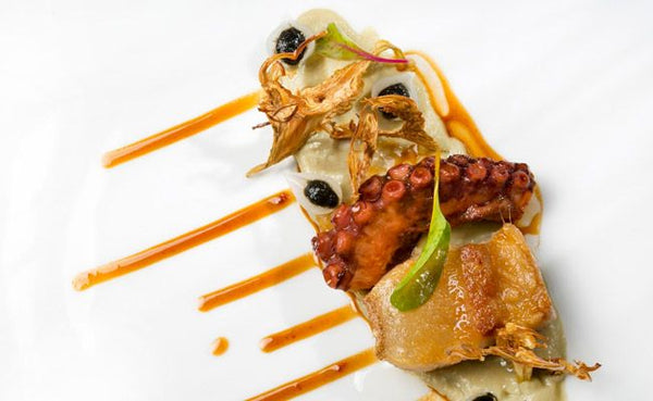 Pulpo y papada ibérica con alcachofas en Casa Manolo